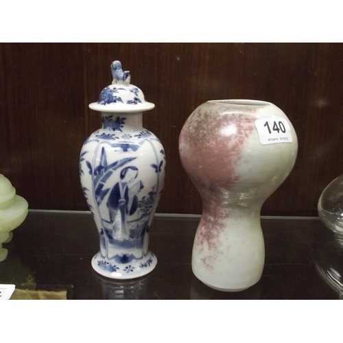 140 - Oriental blue and white baluster vase with cover, and a studio ceramic vase.