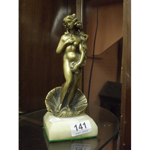 141 - Brass figure of a nude female on alabaster base, 9 in. high.