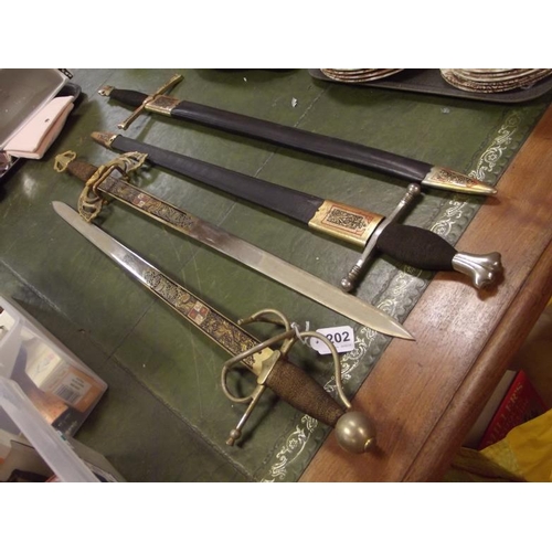 202 - Four Spanish swords, two with scabbards.