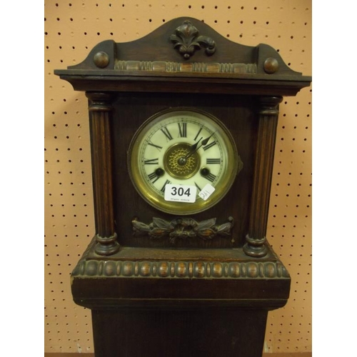 304 - Stained beech grandmother clock, 54 in. high.