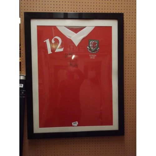 348 - Framed and glazed Wales football shirt No. 12 signed by Sam Ricketts 17/10/07 v. San Marino.