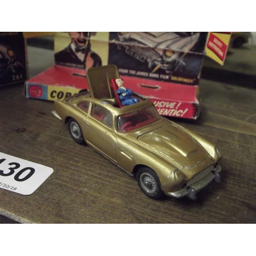 130 - Corgi Toys James Bond's Aston Martin D.B.5, no. 261, with both figures, in box.