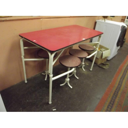 322 - Retro Formica topped dining table having four fold-out chairs.