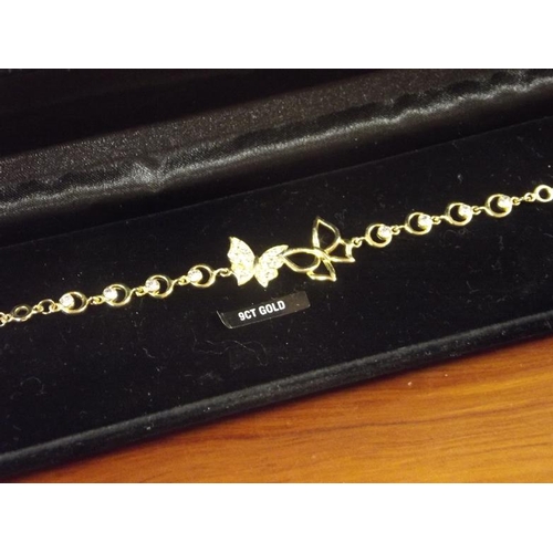 108 - Silver gilt gem set butterfly bracelet.