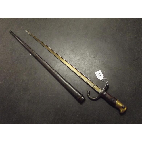 11 - French Gras bayonet with 20.5 in. single edged blade, two piece wooden grip with brass pommel, with ... 