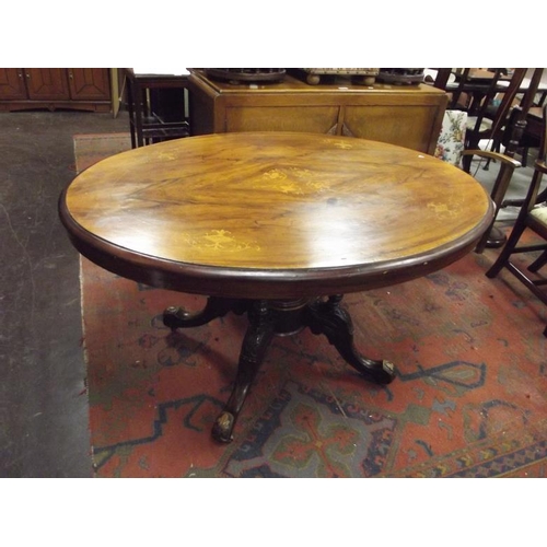 350 - 19th Century inlaid walnut lou table set on quatre form base.