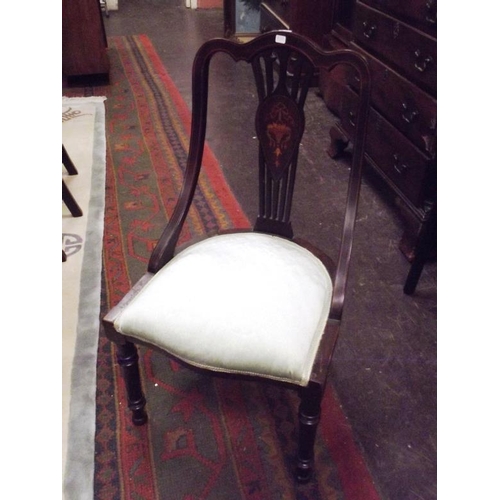 360 - Inlaid mahogany nursing chair having upholstered seat and turned frontal supports.