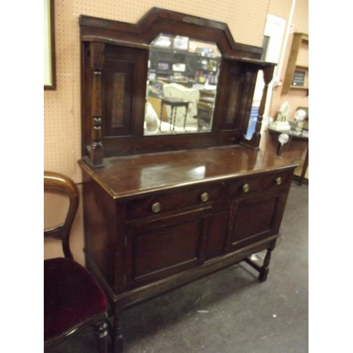 369 - An oak mirror-back sideboard having drawers and cupboard doors to base.