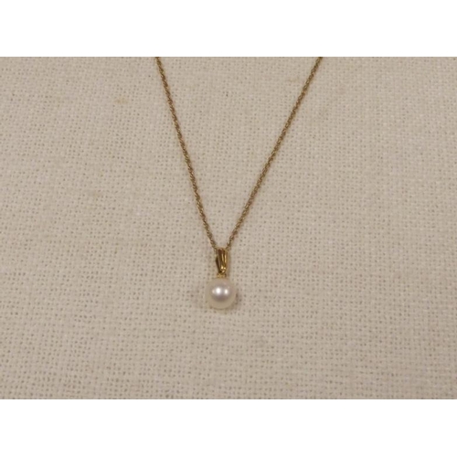 30 - 9 ct. gold mounted pearl pendant, on 9 ct. gold chain, 2.1 g.