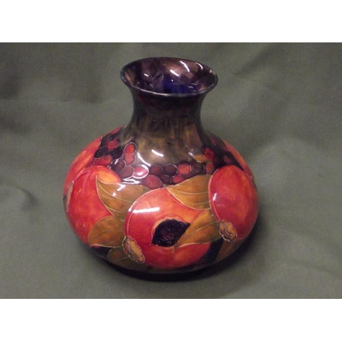 117 - Moorcroft Pomegranate vase, impressed marks with signature, 7.25 in. high.