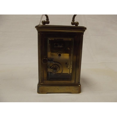 29 - Small gilded brass cased carriage clock, 3.25 in. high.