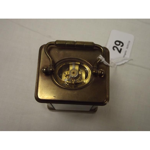 29 - Small gilded brass cased carriage clock, 3.25 in. high.