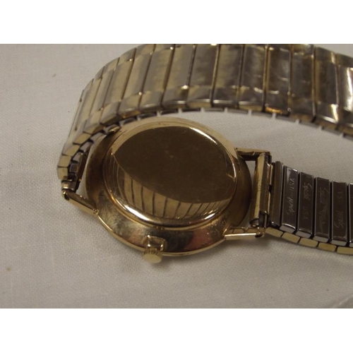 22 - Tissot Seastar Seven 9 ct. gold cased gents wristwatch, silvered dial with gold coloured baton marke... 