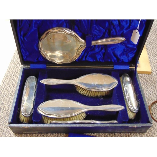 108 - George V six piece silver backed brush and mirror set, Chester 1913, in case.