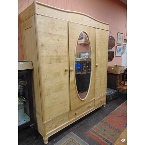 304 - Continental pine wardrobe, centre mirror flanked by two doors  and three drawers to base, 84 x 71 x ... 