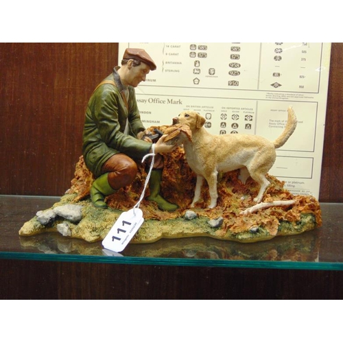 111 - Composite group of a hunter with dog and game.