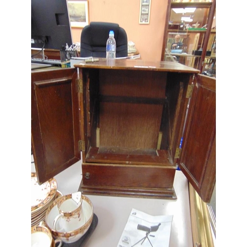 119 - An oak double door smoker's cabinet.