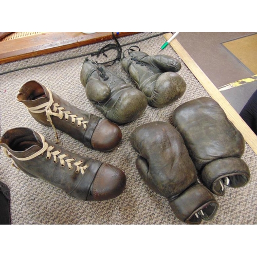 3 - Two pairs of vintage leather boxing gloves and a pair of leather football boots, the soles inscribed... 
