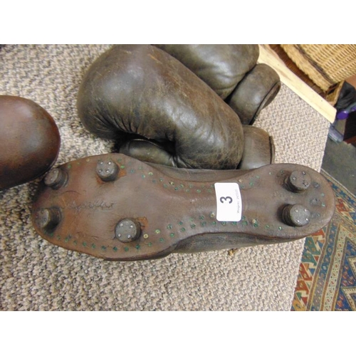 3 - Two pairs of vintage leather boxing gloves and a pair of leather football boots, the soles inscribed... 