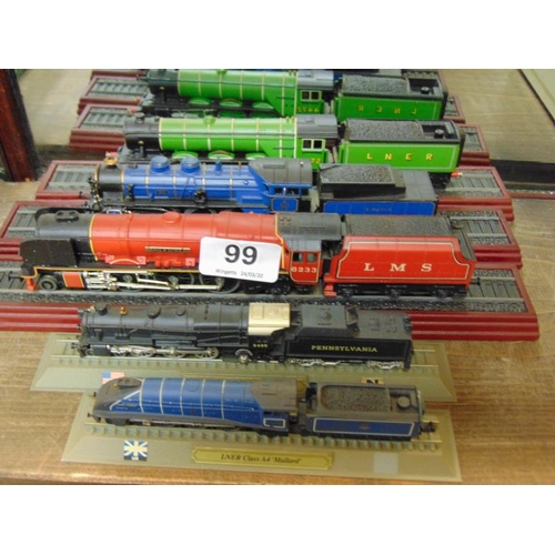 99 - Five scale model trains.
