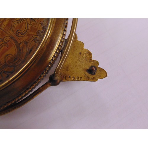 19 - Gubelin Swiss gilt metal cased easel clock having cabochon set winder, blue guilloche enamel dial, t... 