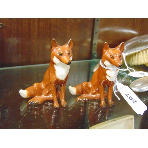 207 - Two Beswick seated Fox figures.