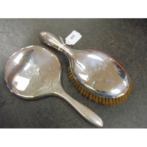 208 - Chester Silver backed dressing table brush together with a Birmingham Silver backed hand mirror (2).