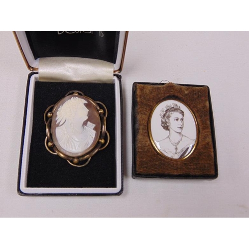 217 - Reproduction Cameo brooch and one other brooch commemorating Her Majesty Queen Elizabeth II .