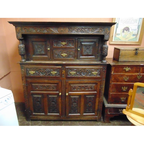 319 - Antique Oak Welsh cwpwrdd dauddarn, ogive cornice above carved top with two short drawers flanked by... 