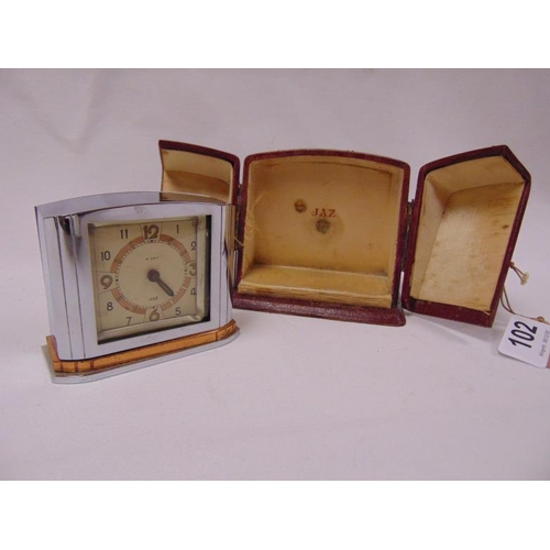 102 - Jaz chrome cased Art Deco travel clock in fitted case.