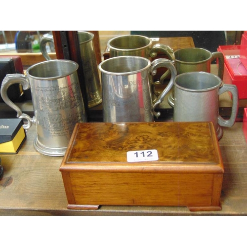 112 - Burr oak cigarette box with fitted interior and three pewter tankards.