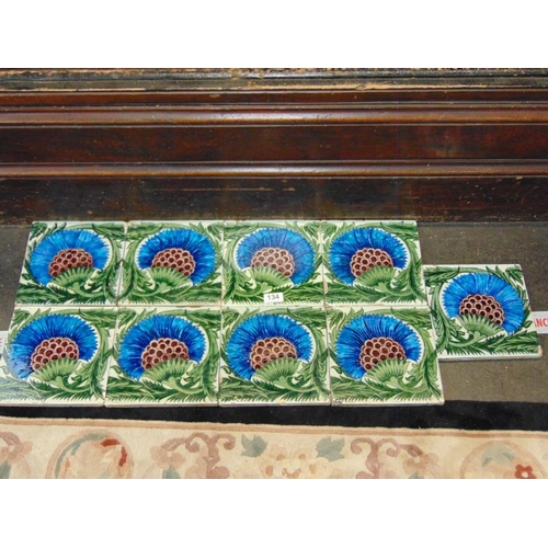 134 - Set of nine William de Morgan tiles decorated with stylized floral motifs, each 8.25 in. square.