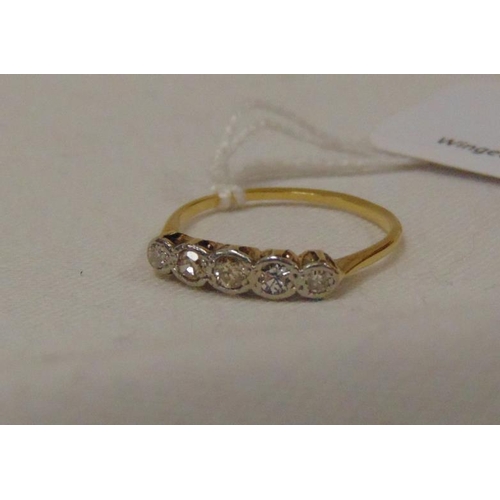 15 - 18 ct gold (tested) five stone diamond ring, size R, 2.1 g.