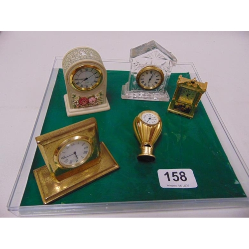 158 - Five miniature clocks.