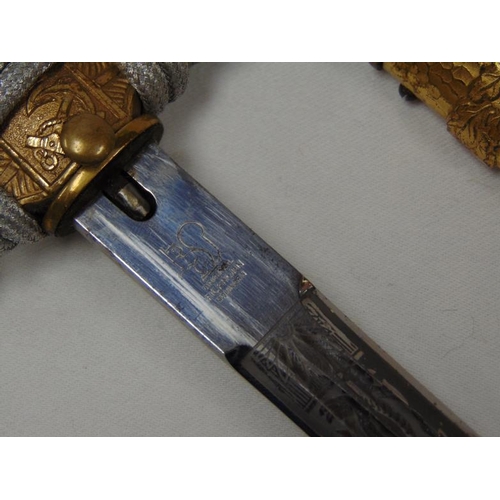 21 - Eickhorn Solingen Kriegsmarine dagger, 9.75 in. acid etched blade in gold hammered scabbard.