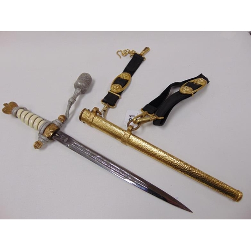 21 - Eickhorn Solingen Kriegsmarine dagger, 9.75 in. acid etched blade in gold hammered scabbard.