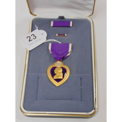 23 - American Purple Heart medal with ribbon and ribbon bar.