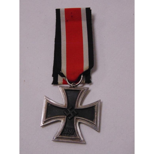 26 - World War Two German Iron Cross, Second Class, maker J.E. Hammer & Sohne, with ribbon.