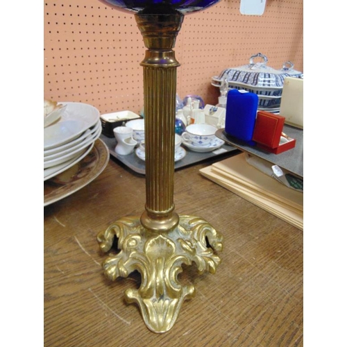 29 - Good oil lamp with gilded cast brass base and column, blue glass reservoir and shade.