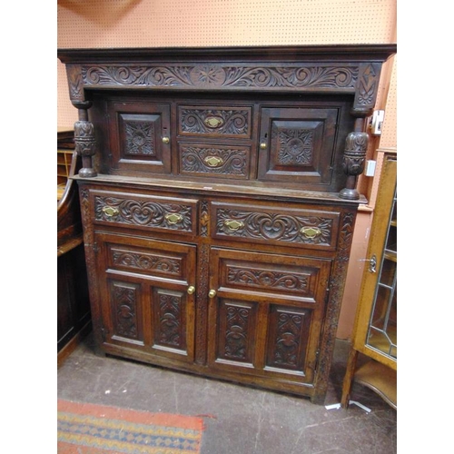 319 - Antique Oak Welsh cwpwrdd dauddarn, ogive cornice above carved top with two short drawers flanked by... 