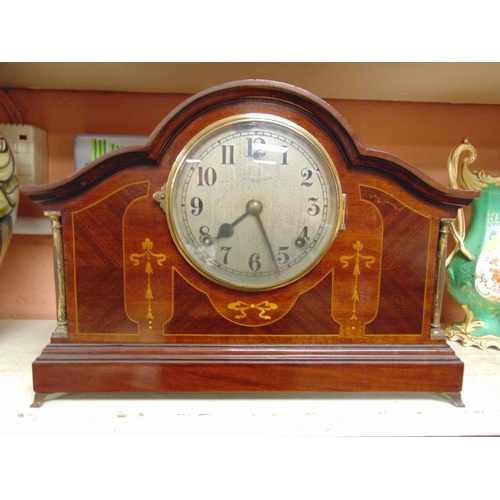 33 - Inlaid mahogany cased dome top mantel clock, 8 day movement striking on a gong, 11 in. high