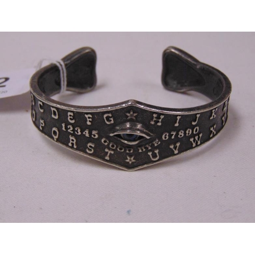 452 - Ladies bangle decorated with tarot markings.