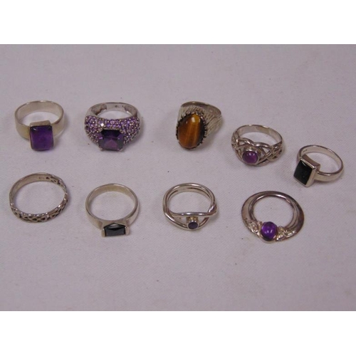 453 - Nine dress rings, marked 925.