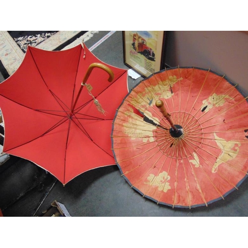 55 - Oriental parasol and one other.