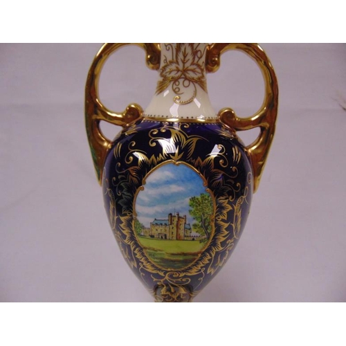 6 - Coalport two handled cobalt blue and cream vase, ornately gilded adn with two panels painted with th... 