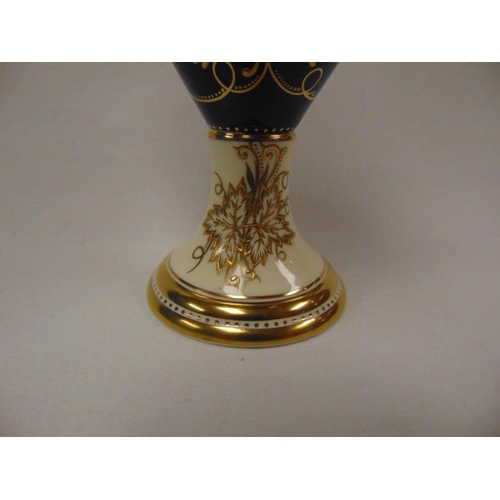 6 - Coalport two handled cobalt blue and cream vase, ornately gilded adn with two panels painted with th... 