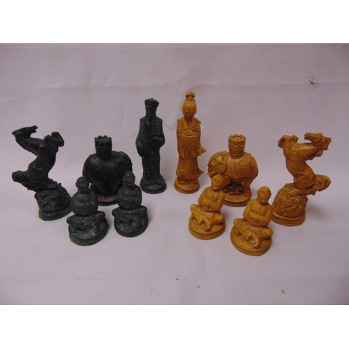 61 - Painted composite chess set.