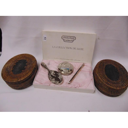 63 - Boxed Art Nouveau style plated dressing table set and two vintage oval wicker boxes.