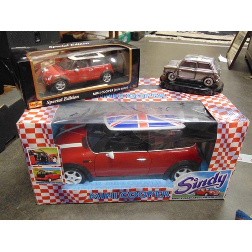 66 - Sindy Mini Cooper, boxed as new, boxed Maisto Mini Cooper (sun roof) and a Leonardo Mini Cooper.