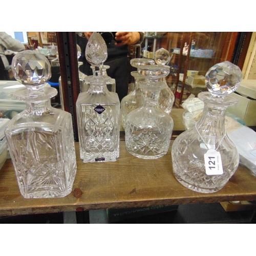 121 - Edinburgh Crystal square cut glass decanter and three others.